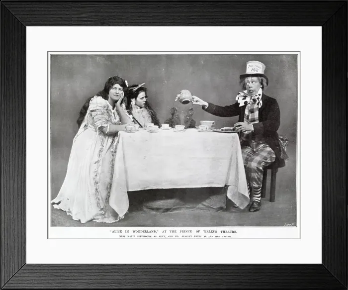 Framed Print : Alice in Wonderland Mad Hatters tea party starring Marie Studholme as Alice and Stanley Brett as the Mad Hatter at The Prince of Wales Theatre, West End, London. Date: 1907 Framed Print : Alice in Wonderland Mad Hatters tea party starring Marie Studholme as Alice and Stanley Brett as the Mad Hatter at The Prince of Wales Theatre, West End, London. Date: 1907