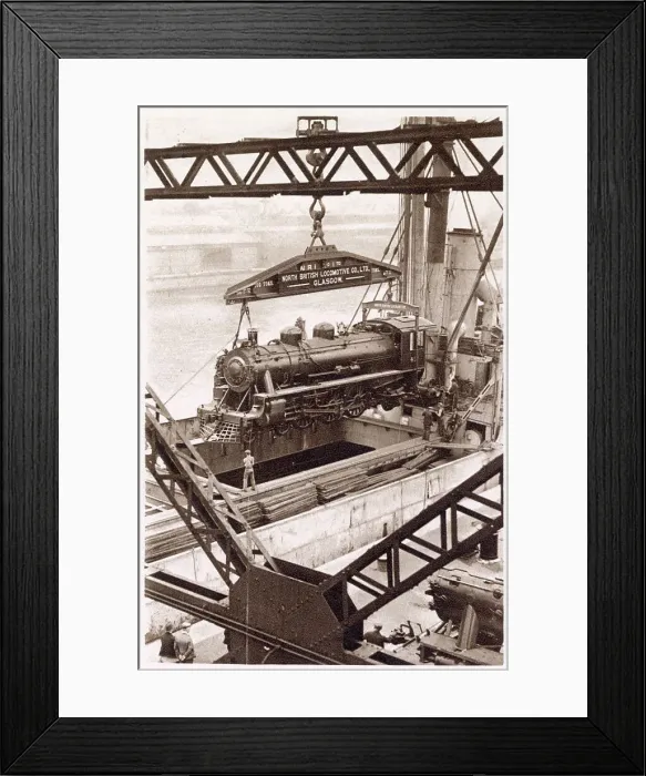 Framed Print : One of the eight engines built under contract by the North British Locomotive Company, Ltd, being shipped aboard the M. V Beldis. Date: 1933