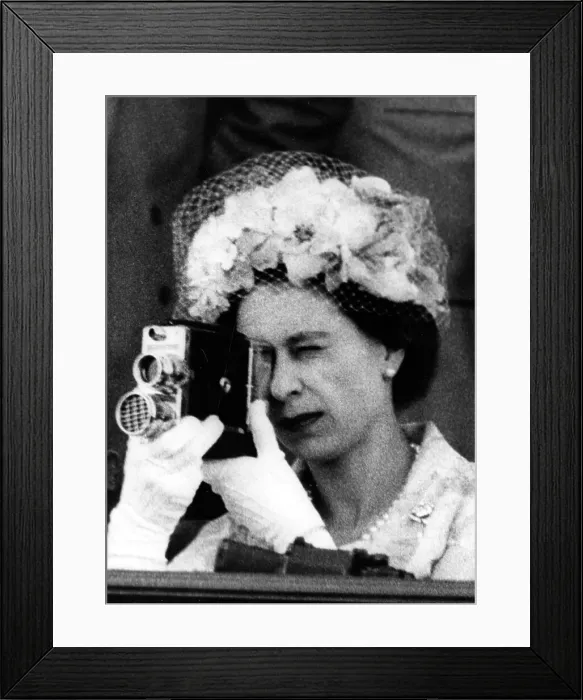 Framed Print : Queen Elizabeth II using a cine camera Framed Print : Queen Elizabeth II using a cine camera