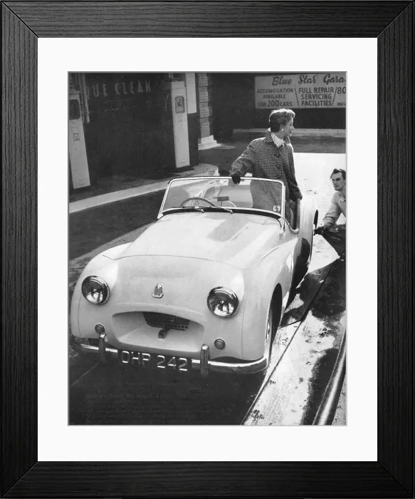 Framed Print : A coat by Moorcott to drive a Triumph sports car