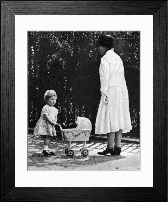 Framed Print : Princess Elizabeth playing with a toy pram Framed Print : Princess Elizabeth playing with a toy pram