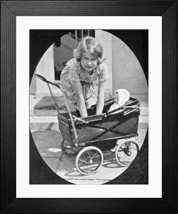 Framed Print : Princess Elizabeth playing with dolls pram Framed Print : Princess Elizabeth playing with dolls pram