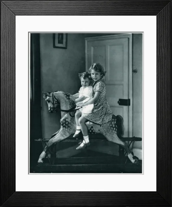 Framed Print : Princesses Elizabeth and Margaret on a rocking horse