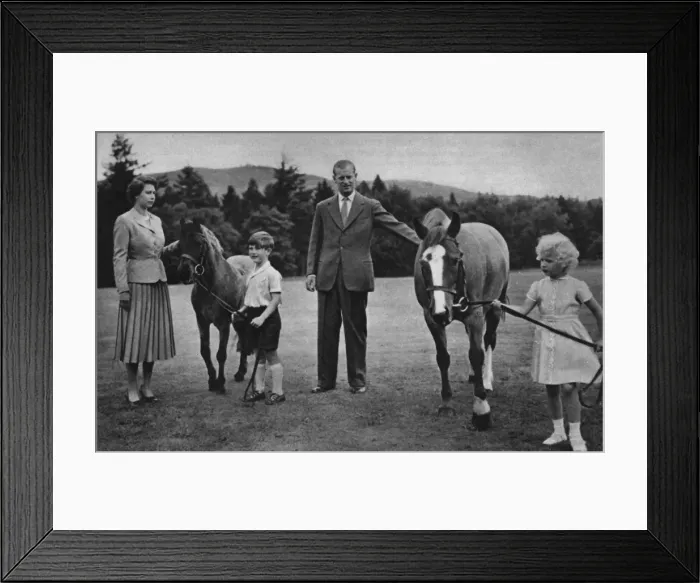Framed Print : The Queen and Prince Philip play with their children, ponies Framed Print : The Queen and Prince Philip play with their children, ponies