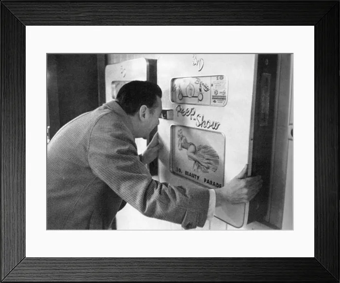 Framed Print : Robin Maugham looking at a peep-show in Brighton Framed Print : Robin Maugham looking at a peep-show in Brighton