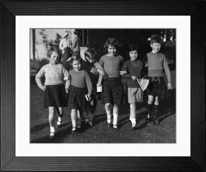 Framed Print : Queen Elizabeth II attends a birthday party as a girl Framed Print : Queen Elizabeth II attends a birthday party as a girl