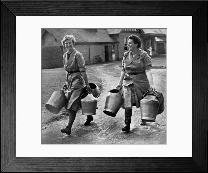 Framed Print : Land Army Girls carry milk pails, 1939 Framed Print : Land Army Girls carry milk pails, 1939