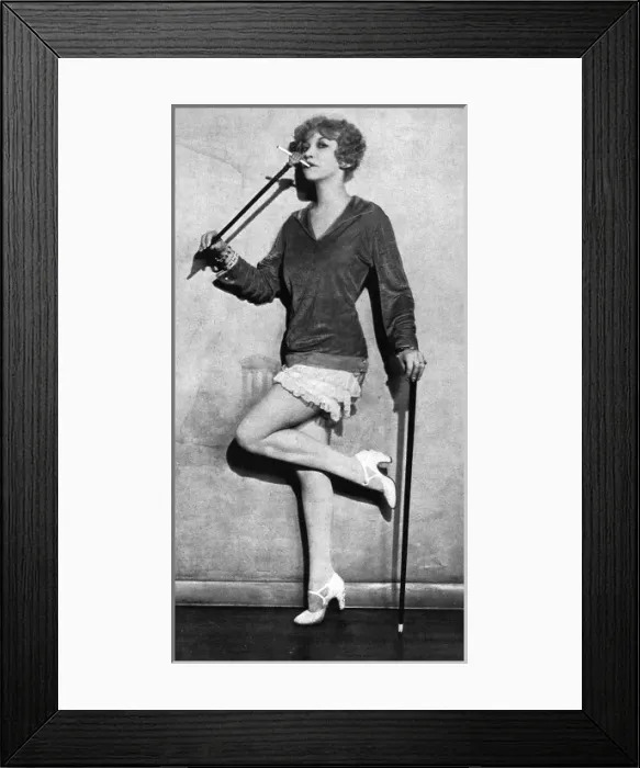 Framed Print : Frances Day with an unusual cigarette holder