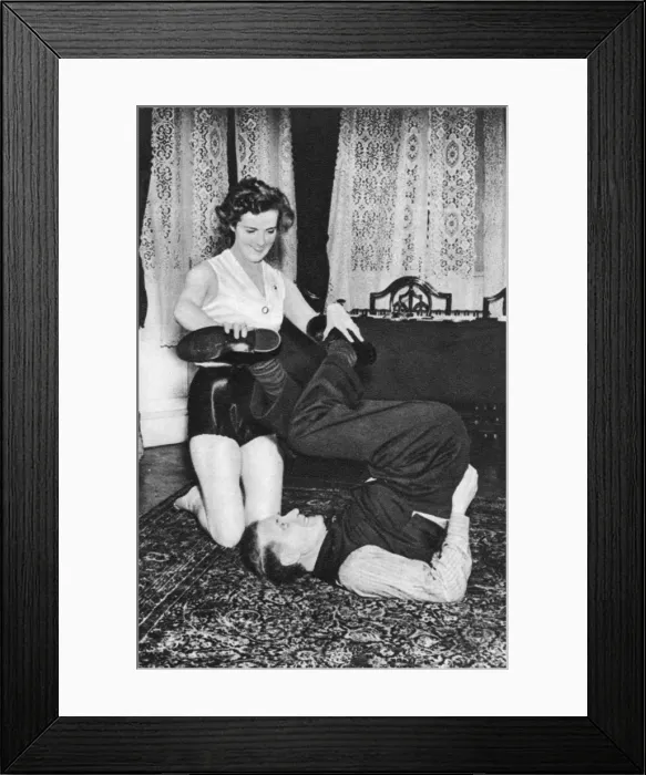Framed Print : Prunella Stack maniuplating Herbert Barkers legs, 1939