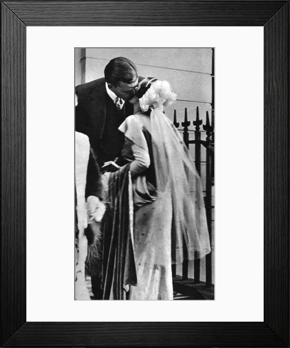 Framed Print : Mr & Mrs Sweeny kiss each other goodbye
