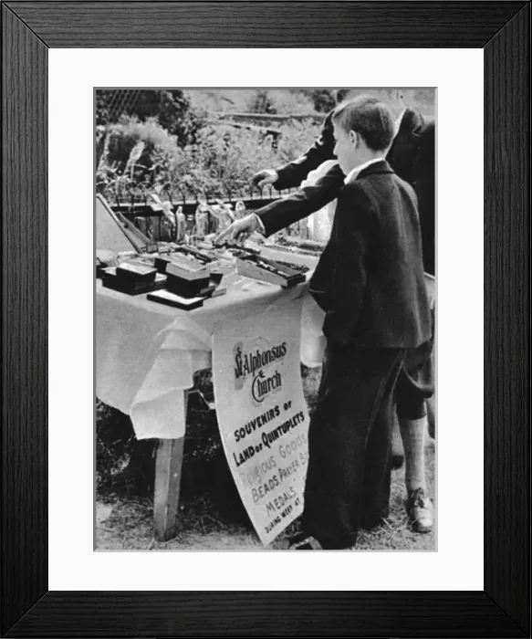 Framed Print : Dionne quintuplets, 1936: religious goods sought by tourists Framed Print : Dionne quintuplets, 1936: religious goods sought by tourists