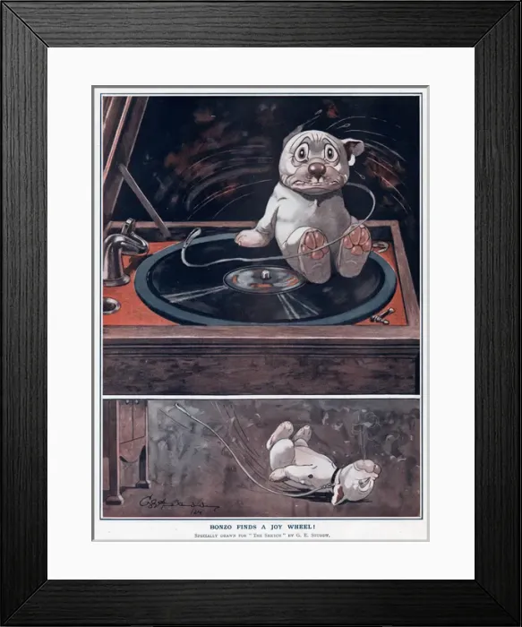 Framed Print : Bonzo finds a joy wheel! by George Studdy Framed Print : Bonzo finds a joy wheel! by George Studdy