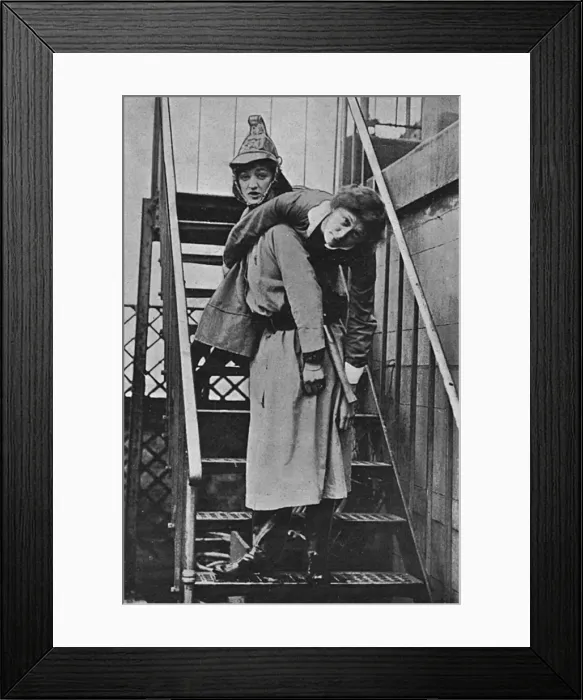 Framed Print : Firewomen, a rescue on an iron staircase, WW1 Framed Print : Firewomen, a rescue on an iron staircase, WW1