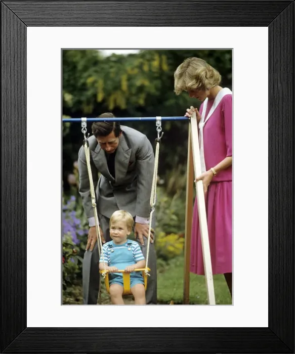 Framed Print : A young Prince William on a swing next to his parents Framed Print : A young Prince William on a swing next to his parents