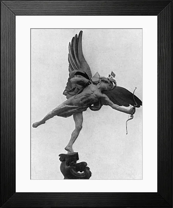 Framed Print : Eros in Piccadilly Circus with flags on his head, WW1 Framed Print : Eros in Piccadilly Circus with flags on his head, WW1