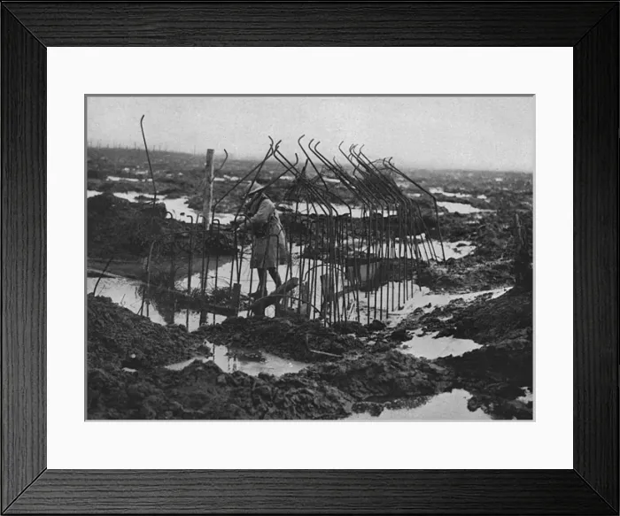 Framed Print : British soldier examing framework of pill-box, WW1 Framed Print : British soldier examing framework of pill-box, WW1