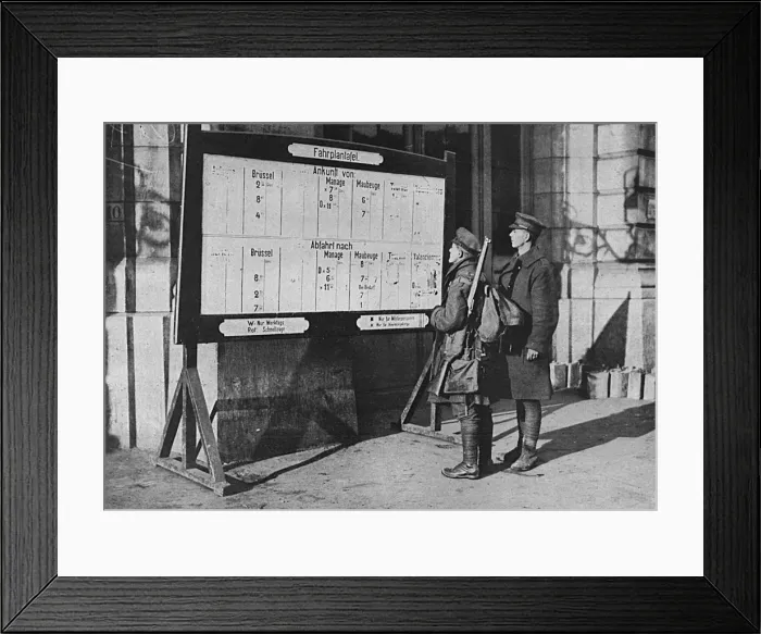 Framed Print : British soldiers looking at German timetable in Mons station