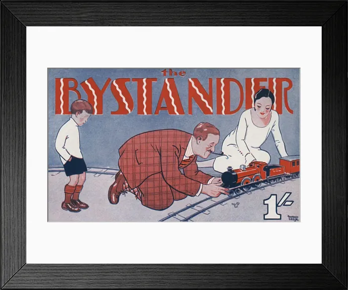 Framed Print : Bystander masthead 1929, playing with train set Framed Print : Bystander masthead 1929, playing with train set