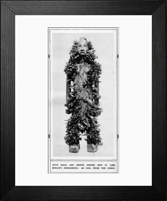 Framed Print : An idol from the Congo with nails and knives driven into it