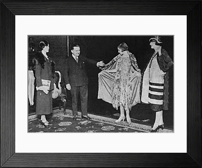 Framed Print : Jean Peron shows off two of his couture creations Framed Print : Jean Peron shows off two of his couture creations