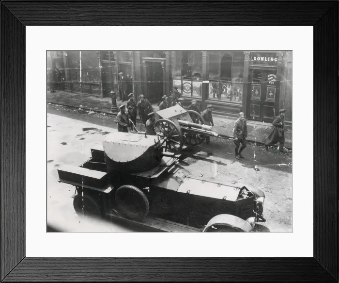 Framed Print : Easter Rising, 1916. Soldiers with gun and armoured car in the streets of Dublin outside Dowling or Dowling's pub. Date: 1916