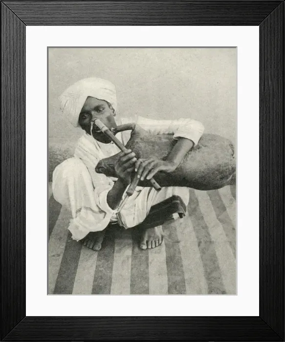 Framed Print : Indian musician plays noseflute and bagpipes simultaneously Framed Print : Indian musician plays noseflute and bagpipes simultaneously