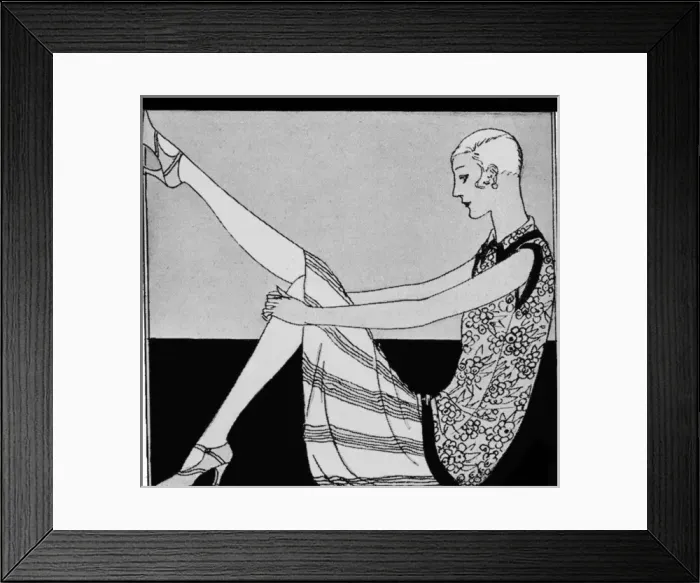 Framed Print : 1920s woman admiring her shoes