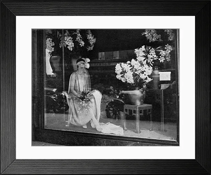 Framed Print : Debutante poses in a shop window, 1928 Framed Print : Debutante poses in a shop window, 1928