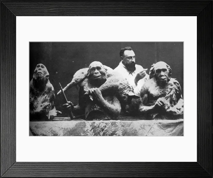 Framed Print : Louis Mascre with sculptures of evolutionary man Framed Print : Louis Mascre with sculptures of evolutionary man
