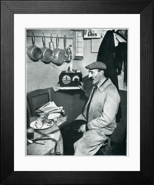 Framed Print : Outbreak of WWII Parisian greengrocer listens to the news