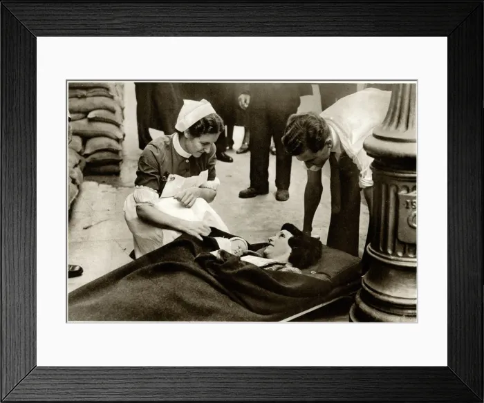 Framed Print : New mother evacuated from hospital 1939