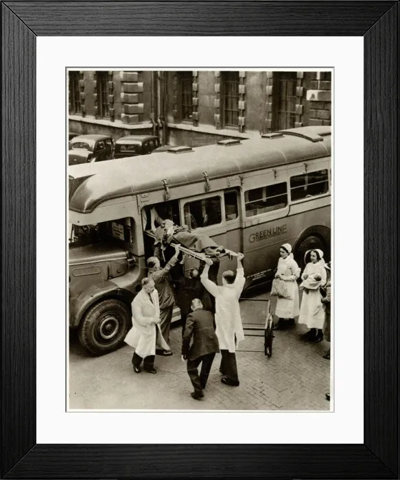 Framed Print : Patient on stretcher lifted onto evacuation coach 1939 Framed Print : Patient on stretcher lifted onto evacuation coach 1939