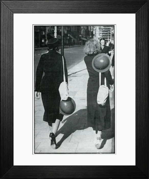 Framed Print : Backs of two walking girls holding helmets, September 1939 Framed Print : Backs of two walking girls holding helmets, September 1939