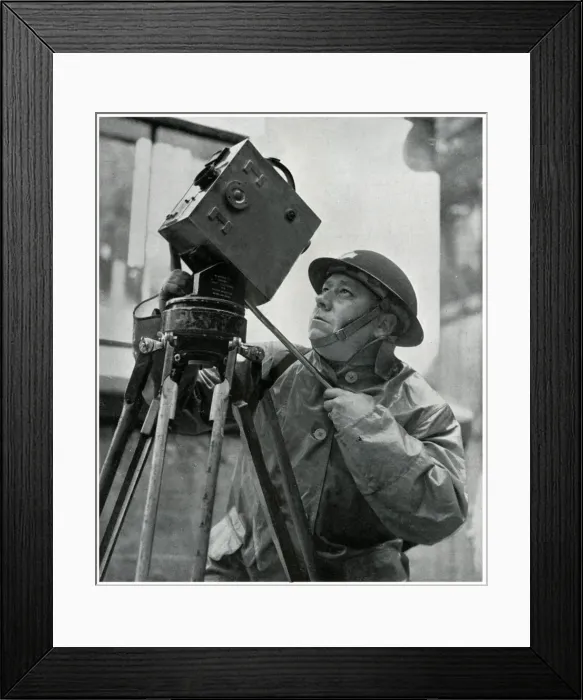 Framed Print : Cinematographer adjusts his camera, September 1939 Framed Print : Cinematographer adjusts his camera, September 1939