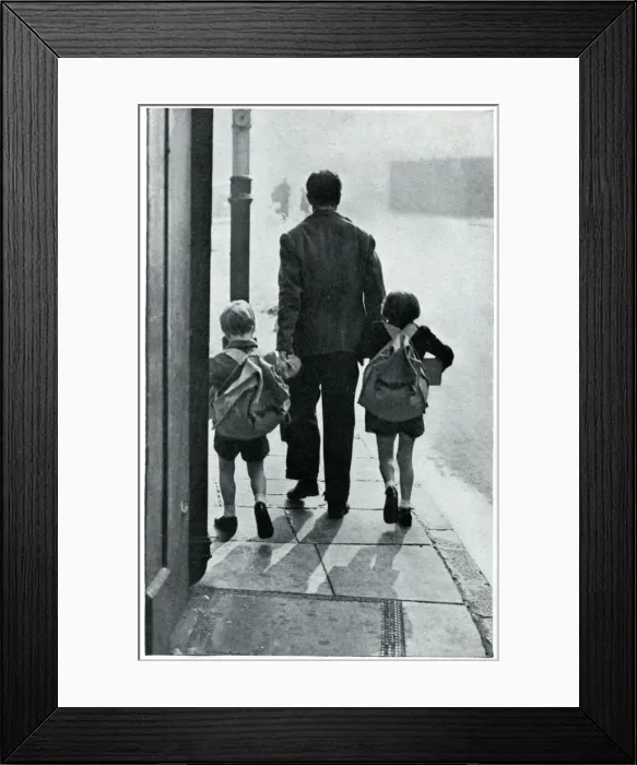 Framed Print : A father leads his two children to be evacuated 1939 Framed Print : A father leads his two children to be evacuated 1939