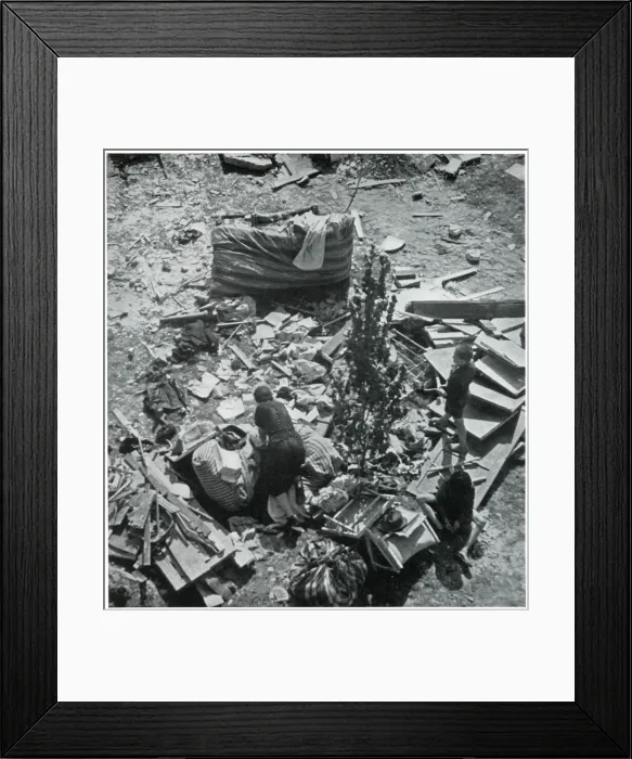 Framed Print : Mother searching for her belongings in debris 1939
