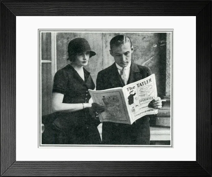 Framed Print : Rudolph Valentino reading The Tatler