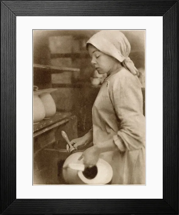 Framed Print : Woman at the cleaning stage of pottery-making. Date: 1913 Framed Print : Woman at the cleaning stage of pottery-making. Date: 1913