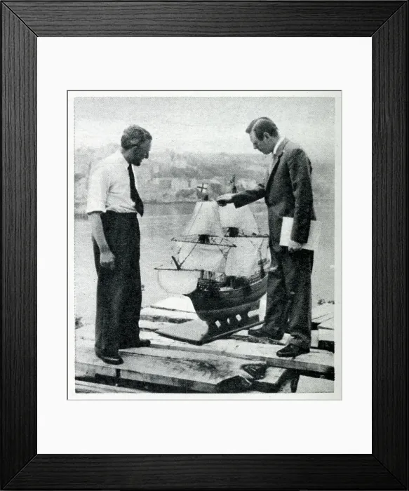 Framed Print : Upham and Charlton inspect a scale model of the Mayflower II, built in the 1950s as an exact replica of the original Mayflower ship. Date: 1956
