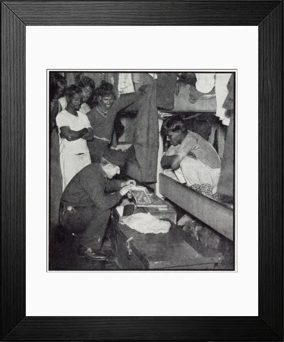 Framed Print : A customs official from the flying squad searches the quarters of a Lascar crew of a sugar freighter to check no dutiable goods have been hidden in odd corners. Date: 1932
