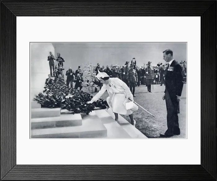 Framed Print : Queen Elizabeth spontaneously placing a single poppy upon the wreath previously laid by the King at the Australian War Memorial during their state visit to France in 1938. Date: 1938