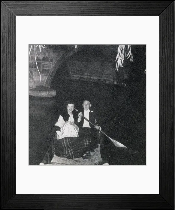 Framed Print : Belinda Stobart and Mr D. K. Wilson out on the river during the May Ball, held by 1st and 3rd Trinity Boat Club at Trinity College. Dancing was on the loggia and in the gardens, while the river was lit by fairy lights. Date: 1956