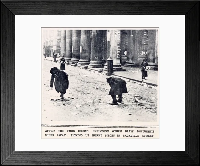 Framed Print : Fighting in Dublin. After the Four Courts explosion which blew documents miles away, burnt pieces are picked up in Sackville Street. Date: 1922 Framed Print : Fighting in Dublin. After the Four Courts explosion which blew documents miles away, burnt pieces are picked up in Sackville Street. Date: 1922