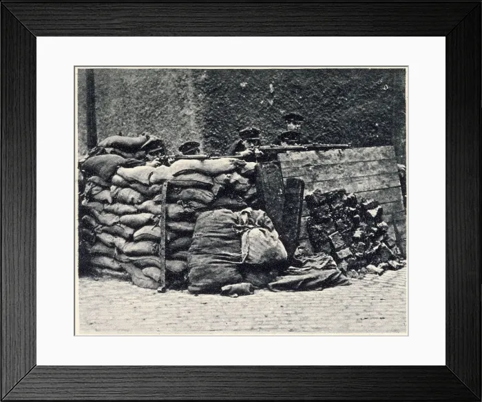 Framed Print : With rifles levelled ready for action. The Provisional Government was most anxious to avoid further bloodshed, photograph showing Governmen troops strongly barricated at a street corner. Date: 2nd July 1922