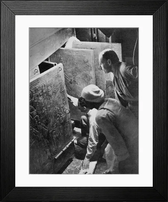 Framed Print : Photograph of the moment Howard Carter (kneeling) and Arthur Callender (standing) actually opening the doors of the fourth shrine of Tutankhamen. Date: 1924 Framed Print : Photograph of the moment Howard Carter (kneeling) and Arthur Callender (standing) actually opening the doors of the fourth shrine of Tutankhamen. Date: 1924