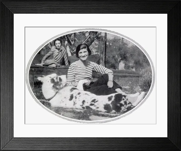 Framed Print : Gabrielle Coco Chanel pictured at her villa, La Pausa, at Roquebrune, Cap Martin on the French Riviera in the company of Baroness de Reuter, and her large dog, Gigot. Date: 1932 Framed Print : Gabrielle Coco Chanel pictured at her villa, La Pausa, at Roquebrune, Cap Martin on the French Riviera in the company of Baroness de Reuter, and her large dog, Gigot. Date: 1932