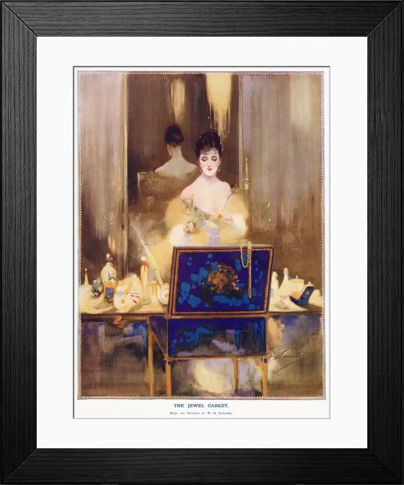 Framed Print : A woman sits at her dressing table contemplating the contents of her large jewellery box, open in front of her. Date: 1916