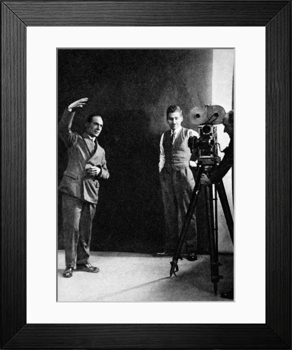 Framed Print : Miming a gesture, the method of registering sunshine, posed