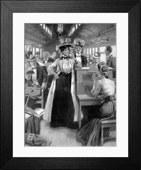 Framed Print : Travelling telephone in use on a express train