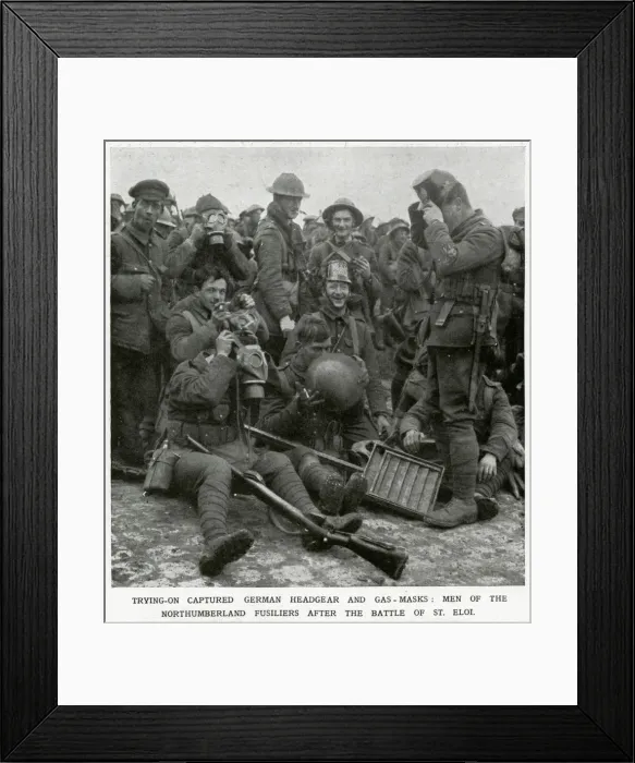 Framed Print : British soldiers trying on captured German headgear 1916